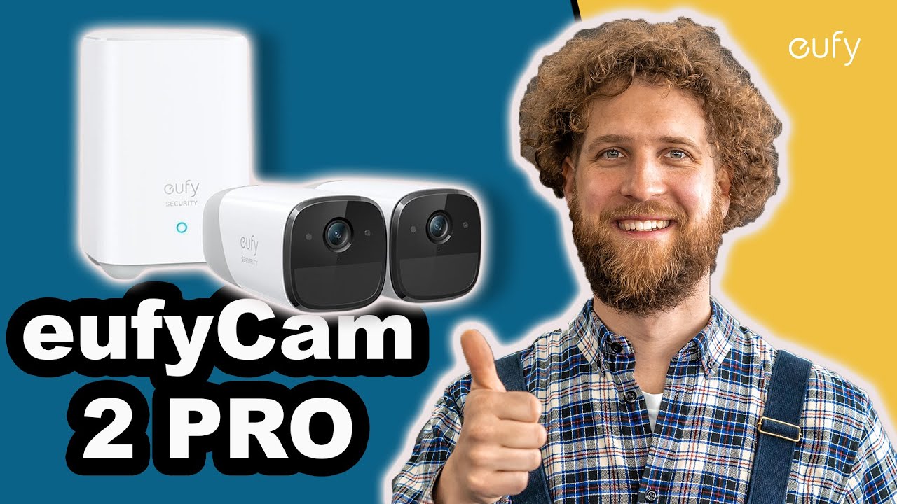 Vorschaubild: Tobias Haack lächelt mit Daumen hoch neben einer weißen eufy-Security-Homebase und zwei weißen Kameras, Schriftzug „eufyCam 2 PRO“